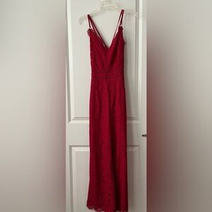 Lady jumpsuit. Criss cross straps.   Scarlet red